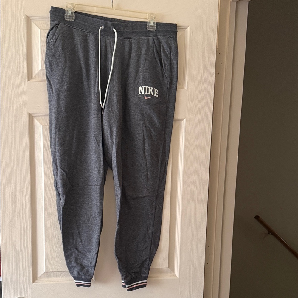 Nike women’s Charcoal Joggers with White and Pink Accents